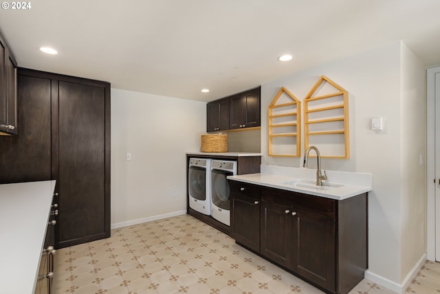 kitchen with sink, separate washer and dryer, and dark brown cabinetry