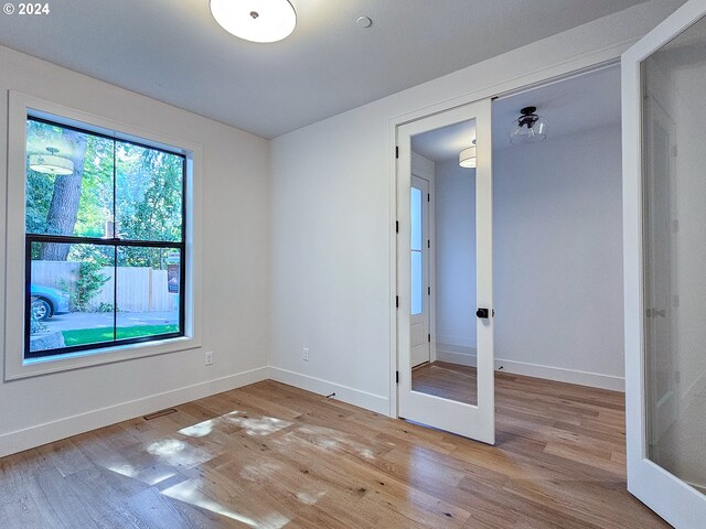 interior space featuring light hardwood / wood-style flooring and french doors