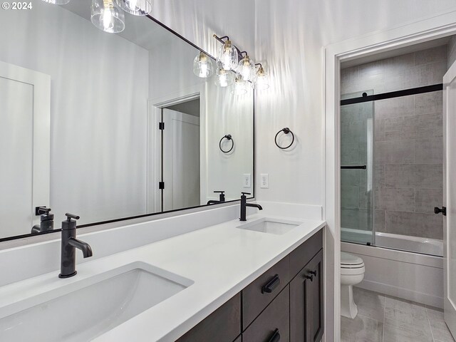 full bathroom with shower / bath combination with glass door, toilet, and vanity