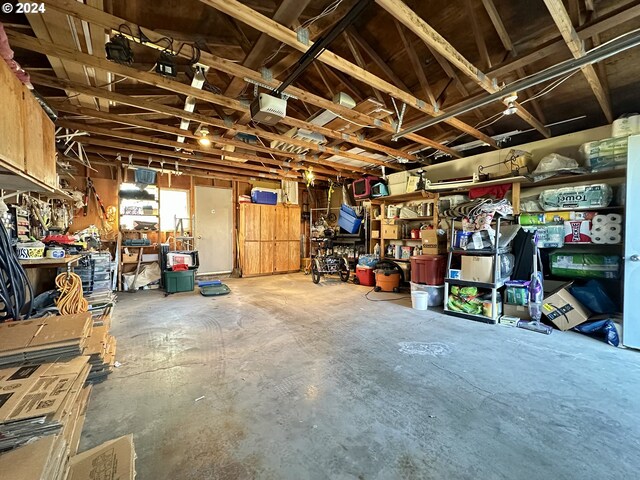 garage featuring a workshop area and a garage door opener