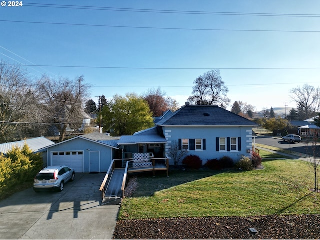 view of front facade featuring a front yard and a garage