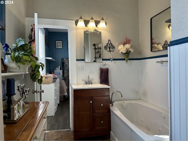 bathroom featuring a bathing tub and vanity