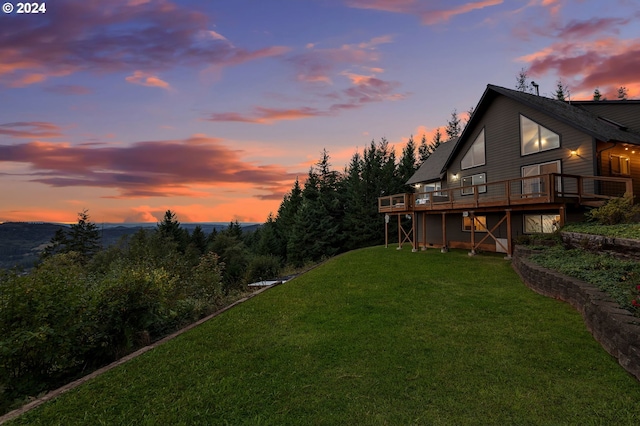 yard at dusk with a deck