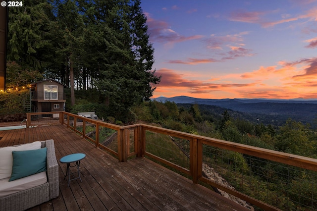 deck at dusk with a mountain view