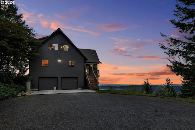 40700 NE Skye View Dr, Washougal, WA 98671 - view of front of property with stairway, gravel driveway, and an attached garage
