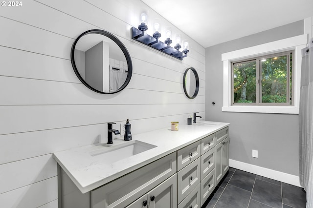 40700 NE Skye View Dr, Washougal, WA 98671 - bathroom with tile patterned flooring, double vanity, and baseboards