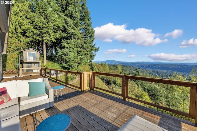 40700 NE Skye View Dr, Washougal, WA 98671 - wooden terrace with a mountain view, an outdoor structure, and a forest view