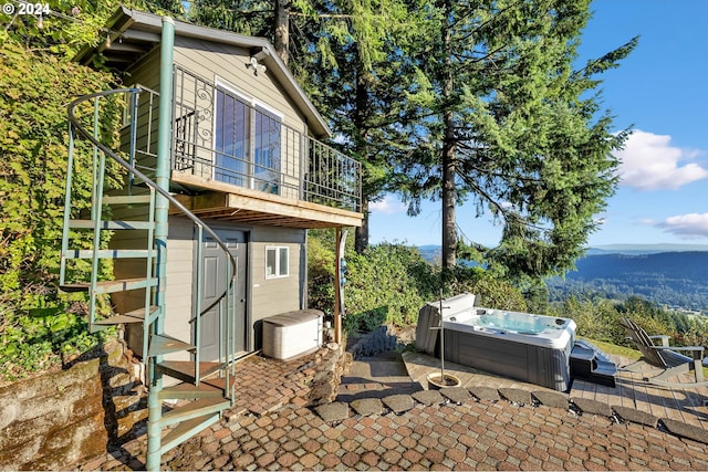 40700 NE Skye View Dr, Washougal, WA 98671 - view of side of property featuring a hot tub, a patio area, central air condition unit, and a mountain view