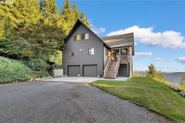 40700 NE Skye View Dr, Washougal, WA 98671 - view of front facade with stairway, a garage, concrete driveway, and a front yard