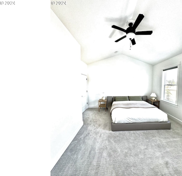 bedroom with lofted ceiling, carpet flooring, and ceiling fan