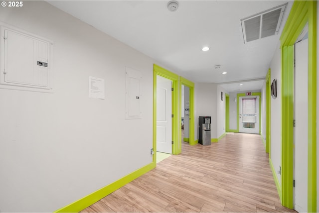 hall featuring electric panel and light wood-type flooring