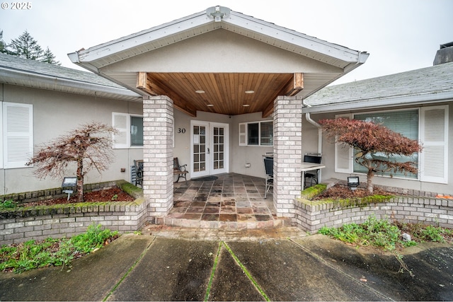 doorway to property featuring french doors