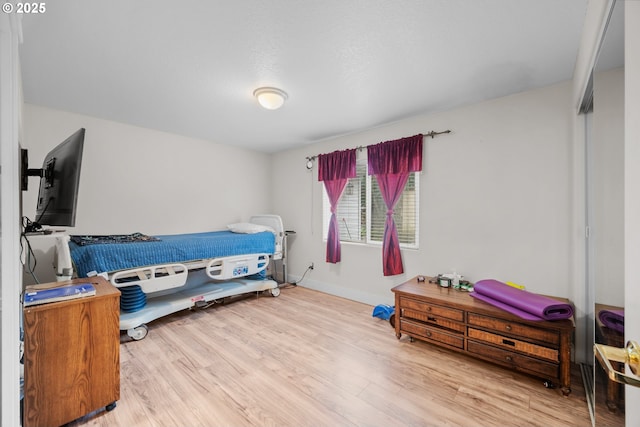 bedroom with light wood-type flooring