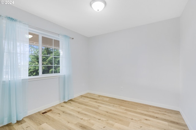 unfurnished room featuring light hardwood / wood-style floors