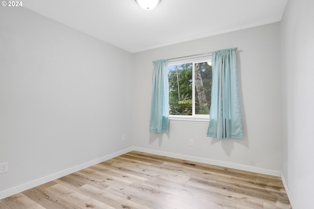 empty room with light wood-type flooring