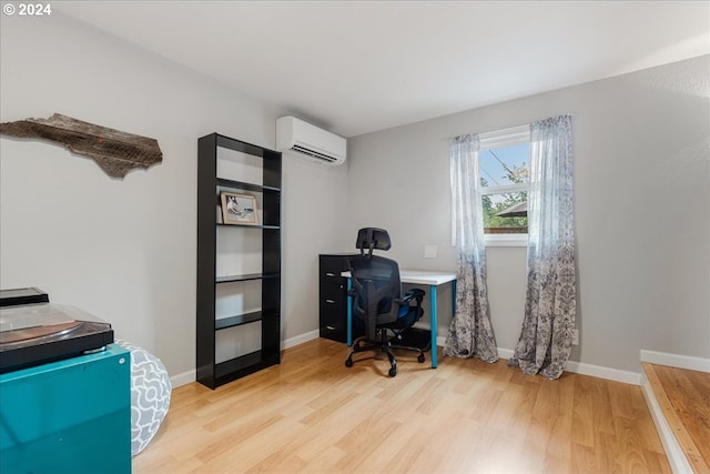 office area featuring light hardwood / wood-style floors and a wall mounted AC