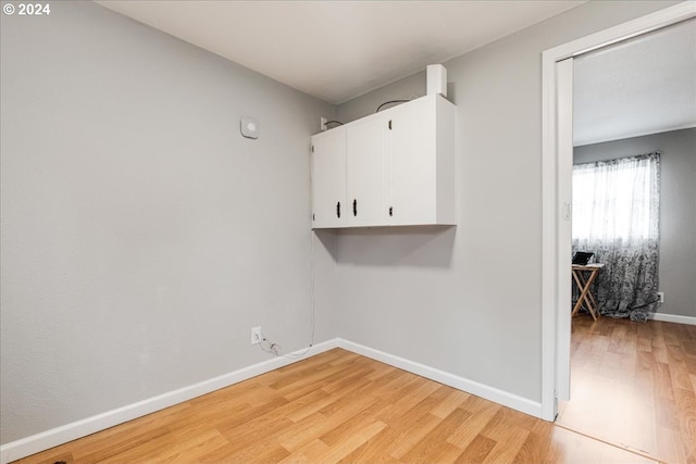 laundry room featuring light hardwood / wood-style floors