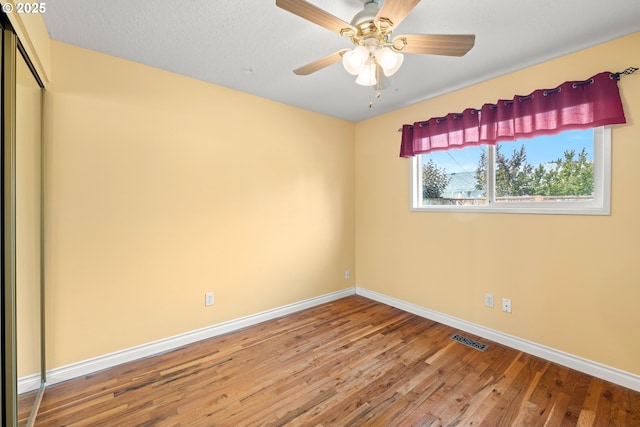 1499 Walton Way, Woodburn, OR 97071 - spare room with wood finished floors and a ceiling fan