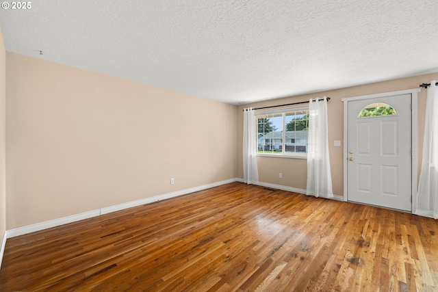 1499 Walton Way, Woodburn, OR 97071 - foyer with wood finished floors and a textured ceiling