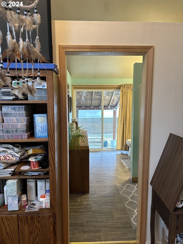 hallway featuring dark wood-type flooring