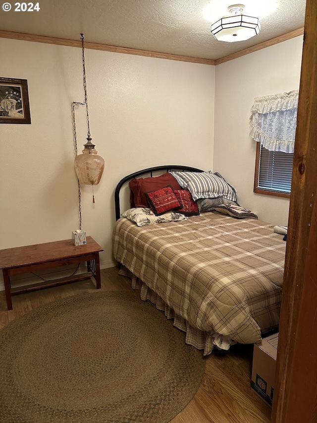 136350 Main St, Crescent, OR 97733 - bedroom featuring crown molding and wood finished floors
