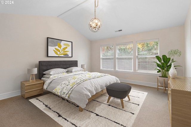 carpeted bedroom featuring lofted ceiling and a notable chandelier