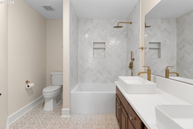 full bathroom with vanity, tiled shower / bath, tile patterned floors, and toilet