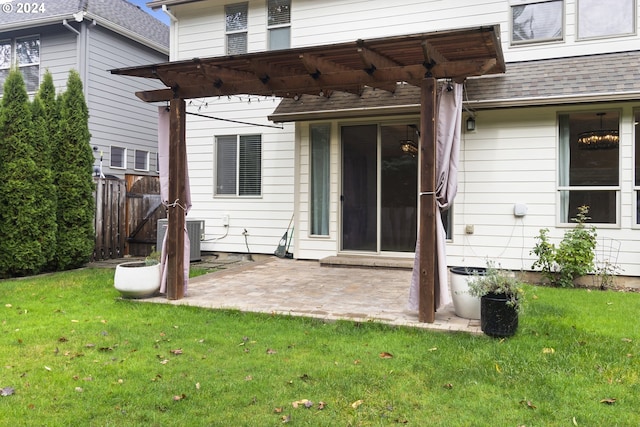 back of property with a pergola, a yard, central AC unit, and a patio area