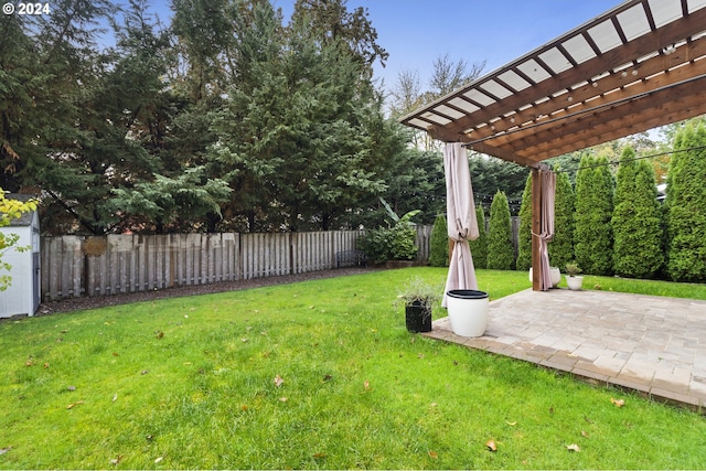 view of yard with a pergola and a patio