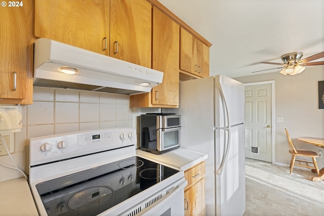 kitchen featuring decorative backsplash, white appliances, and ceiling fan