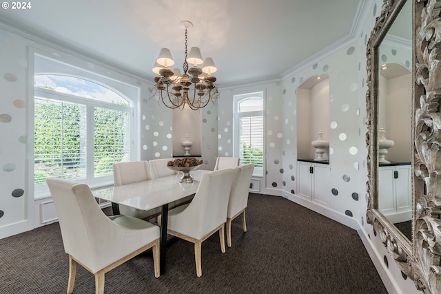 carpeted dining space with a healthy amount of sunlight, a notable chandelier, and ornamental molding