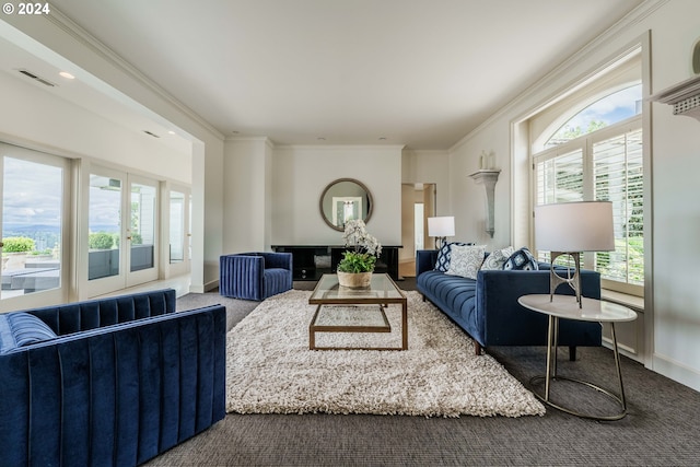 living room with carpet and ornamental molding