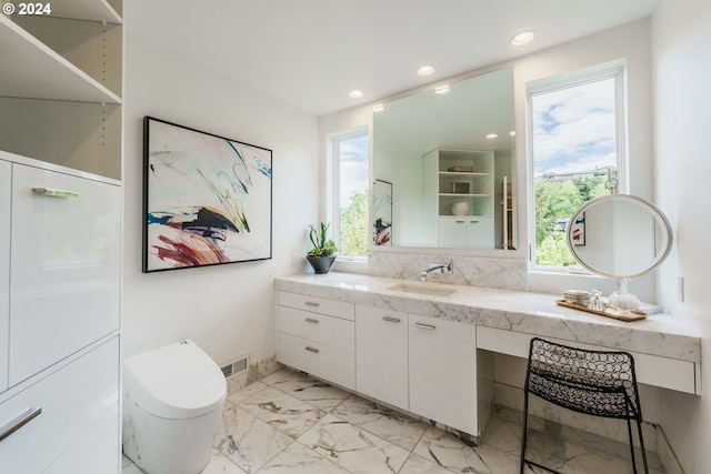 bathroom with vanity and backsplash