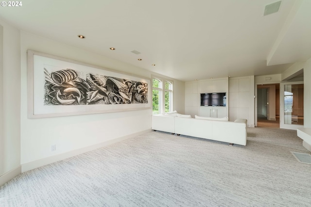 unfurnished living room with light carpet