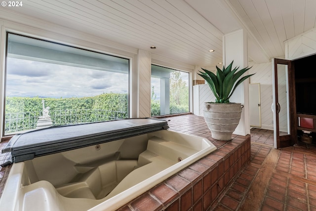 miscellaneous room featuring wood ceiling and a hot tub