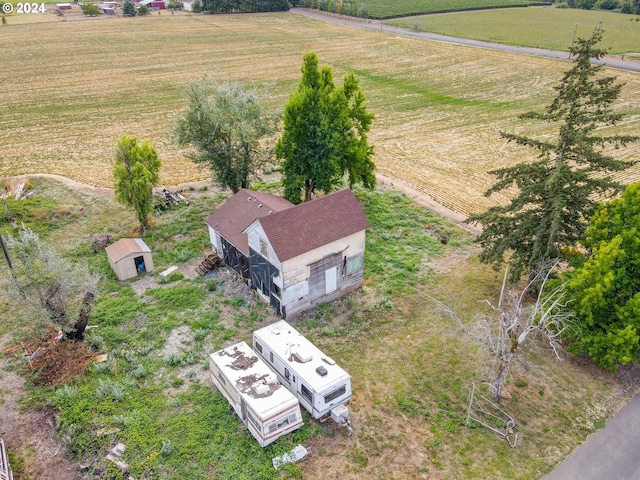 birds eye view of property featuring a rural view