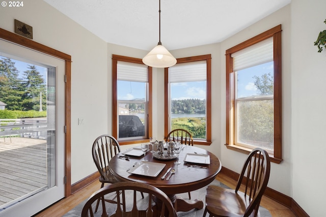 dining space with light wood-type flooring