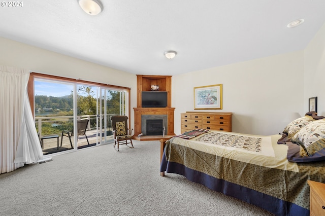 bedroom featuring carpet floors and access to exterior