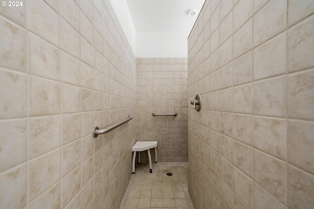 bathroom with tiled shower