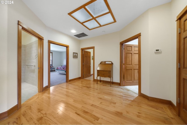 hallway with light wood-type flooring