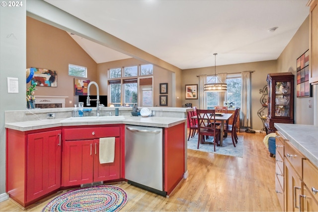 kitchen with dishwasher, light hardwood / wood-style floors, plenty of natural light, and sink