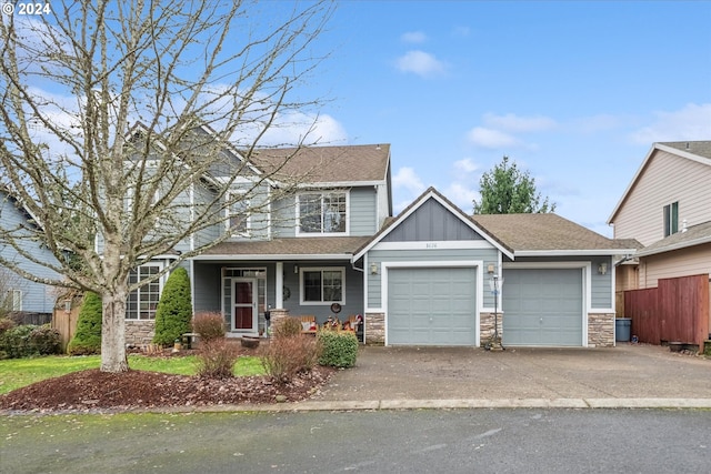 view of front facade with a porch and a garage