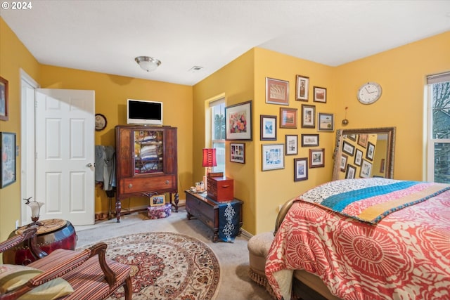 bedroom with light colored carpet