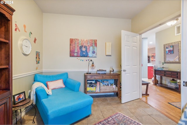 living area featuring light tile patterned flooring