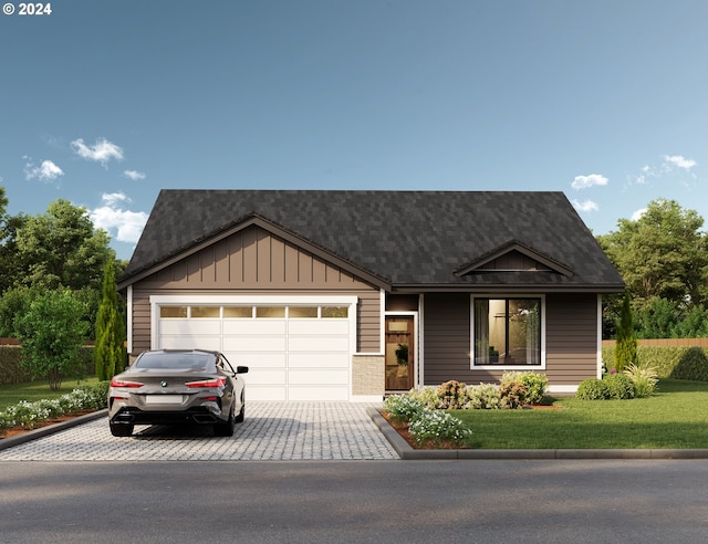 view of front facade with a front yard and a garage