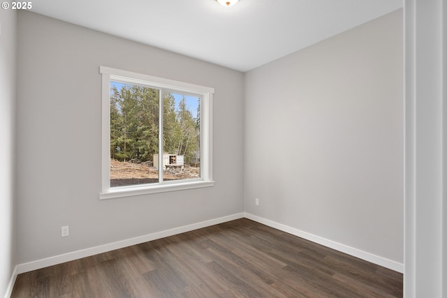 130 E H St, Vernonia, OR 97064 - unfurnished room with dark wood-style flooring and baseboards