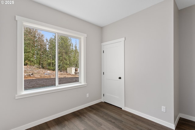 130 E H St, Vernonia, OR 97064 - empty room featuring baseboards and dark wood-style floors