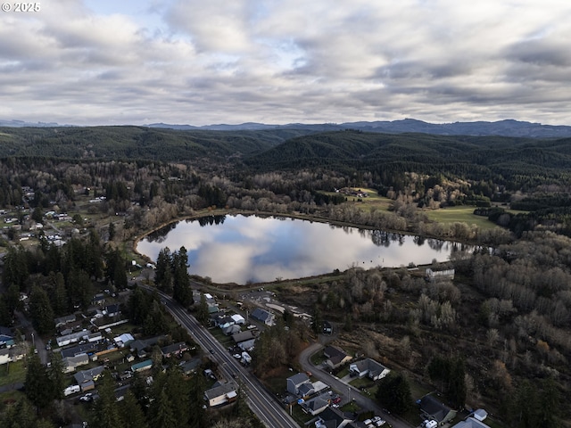 130 E H St, Vernonia, OR 97064 - aerial view of property and surrounding area featuring a water and mountain view and a forest