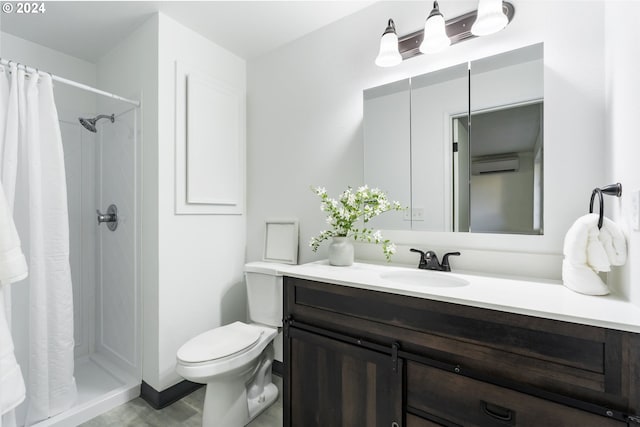 bathroom featuring a shower with curtain, vanity, a wall mounted AC, and toilet