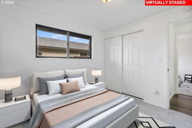 carpeted bedroom with a closet